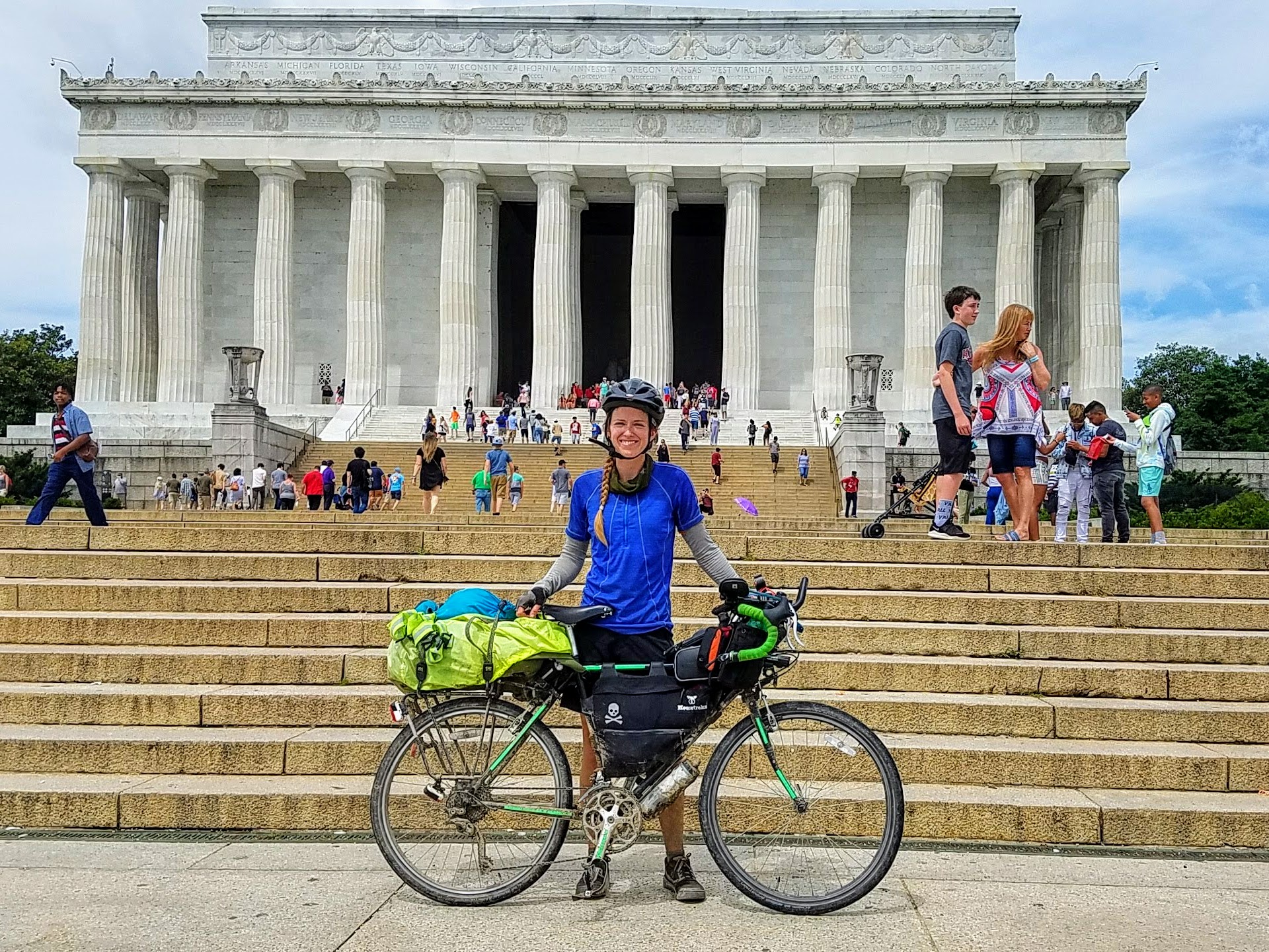 Alissa Bell and her bicycle in front of the Lincoln Memorial